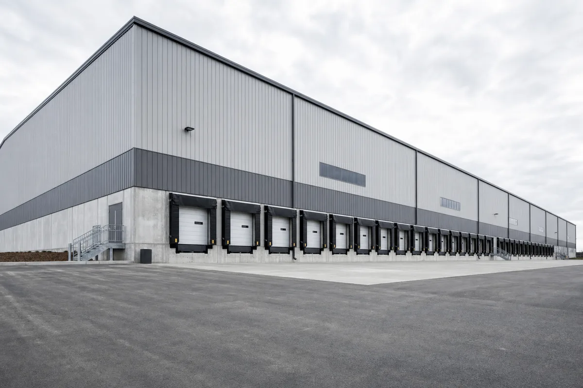 Large modern distribution warehouse with a long row of loading dock doors